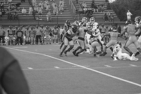 Mamou’s Zamaurri Brown (3) fights for additional yardage in the Green Demons’ 56-0 loss to Opelousas Thursday night. (Gazette photo by Tony Marks)