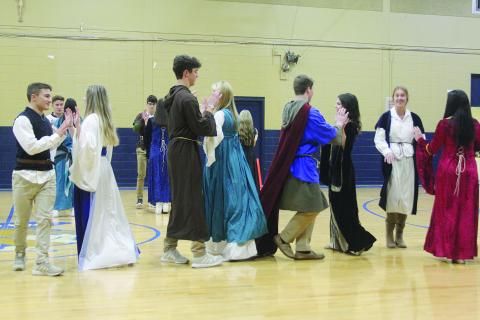 Members of Dorie Ardoin’s world history class at Sacred Heart perform a renaissance dance in the school’s gymnasium during an Open House held Wednesday, November 30. (Gazette photo by Tony Marks)