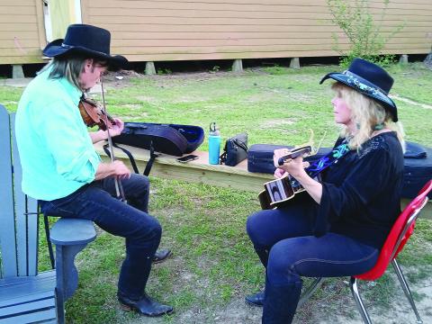 Pat and Cindy Onire, of Mississippi, are pictured playing their instruments during the Balfa Week celebration. The week was not only about music but also featured crafts, food, workshops and more. (LSN photo by Bobby Ardoin)