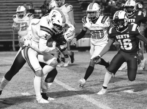 Caden Rollins (1) looks to hold onto the football as he tries to pick up yardage for the Pine Prairie Panthers in a loss to Crowley Thursday night. (LSN photo by Zander Quebedeaux)