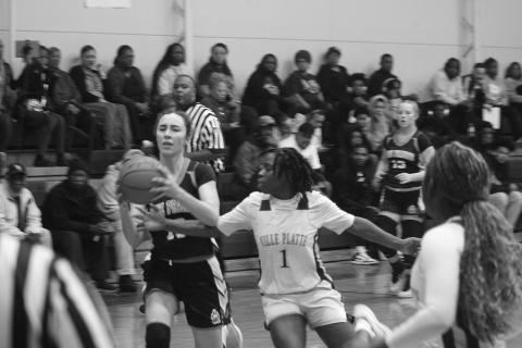 Britelah Freeman (1) attempts to steal the ball away from Jolie Redmon (10) in Ville Platte’s district opening win over Pine Prairie. (Gazette photo by Tony Marks)