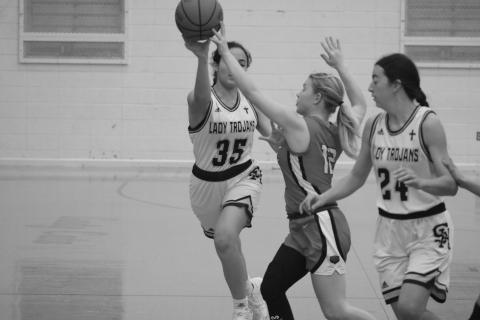 Sacred Heart’s Mary Perron (35) is able to get off a pass in the Lady Trojans’ 66-12 win over Basile to begin the parish tournament.