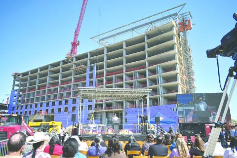 In the left photo, guests watch as the final beam was installed on the construction site of the new hotel being built at Coushatta Casino Resort.