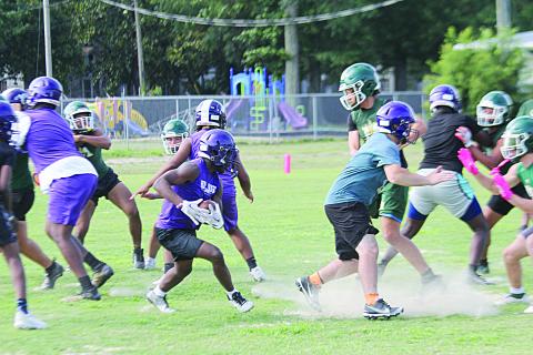 The Ville Platte Bulldog and Mamou Green Demon football teams came together for an interscholastic practice on Wednesday morning. For first-year head coaches Christopher Bland and LaQuintin Lamb, the goal of the practice was to give their teams live competition that will make them better for the upcoming season. The ultimate goal for both, though, is to help rebuild Evangeline Parish football as a whole to the place of prominence they feel it deserves. (Gazette photo by Rhett Manuel)