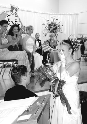 A SPECIAL COTTON QUEEN MOMENT - As she said farewell to her reign as Queen Cotton XLVII, Theresa Martin was surprised by her boyfriend, Dwayne Jenkins, who got down on one knee and asked her to be his queen forever. The teary-eyed beauty said yes to thunderous cheers from the crowd. (Gazette file photo)