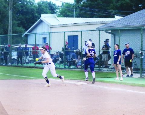 Lady Trojan first baseman Kali Shiver (22) celebrates after recording the final out of the game against Riverside Academy in the quarterfinal round of the state softball playoffs. (Gazette photo by Tony Marks)