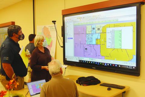 Also holding a public hearing on reapportionment this past Tuesday was the Evangeline Parish School Board. From left are board members Mike Fontenot and Karen Vidrine. Also pictured, with his back turned, is demographer Mike Hefner. (Gazette photo by Tony Marks) 