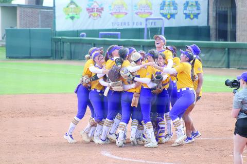 Members of the LSU softball team celebrate inside the pitching circle after the final out was recorded in Sunday’s run-rule win against Southern Illinois. (LSN photo by Tony Marks)