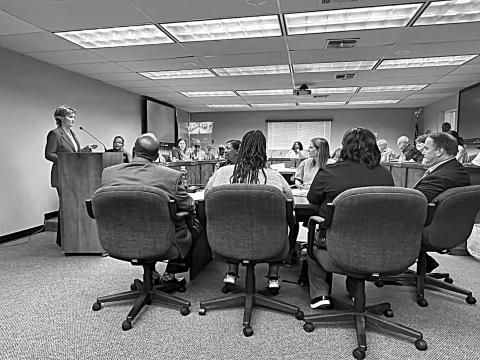 State Representative Rhonda Butler (left) is pictured as she announces the formation of two Star Academies in Evangeline Parish. Among those pictured in the foreground are (from left) Superintendent Darwan Lazard, Board Attorney Betsy Jackson, Board Chief Financial Officer Amy Lafleur, and Assistant Superintendent Michael Lombas. (Photo courtesy of Debby Lawson)