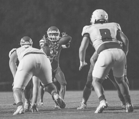 Basile’s Ricky Malone (15) gets the ball in the Wildcat quarterback position during last week’s Homecoming game. (Photo by Tonya Ortego)