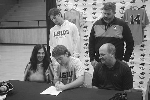 Riley Fontenot (seated in the center) is pictured as he signs with LSUA. Also pictured are: seated (from left) Shelly Fontenot and Ted Fontenot; standing (from left) Cayden McCollough and Dylan Manuel. (Gazette photo by Tony Marks