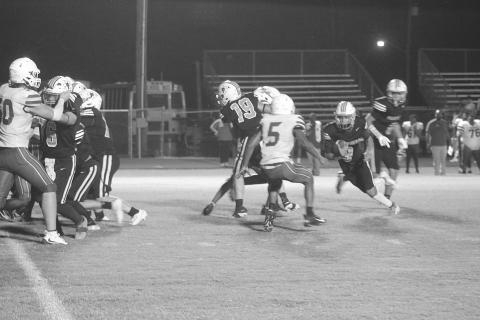 Kameren Guillory (9) finds a running lane for Pine Prairie in a 48-0 loss to Ringgold last week. (Gazette photo by Tony Marks)