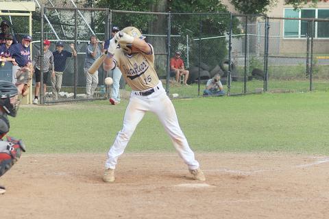 Sacred Heart catcher and two-hole hitter Blake Hebert (15) backs away from the plate as a pitch sails inside in the Trojans’ home playoff loss to Riverside Academy. (Gazette photo by Rhett Manuel)