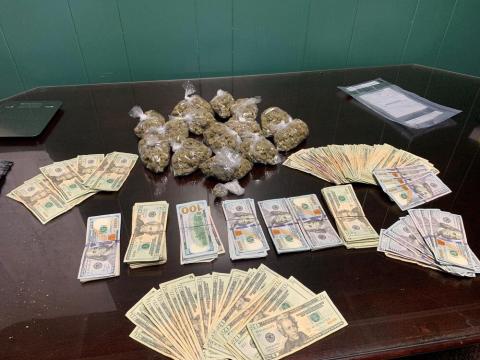 Pictured are marijuana, baggies, and U.S. currency seized during an execution of a search warrant performed by a joint operation among the Evangeline Parish Sheriff’s Office Narcotics Unit and Patrol Unit and the Louisiana Department of Probation and Parole. (Photo courtesy of EPSO)