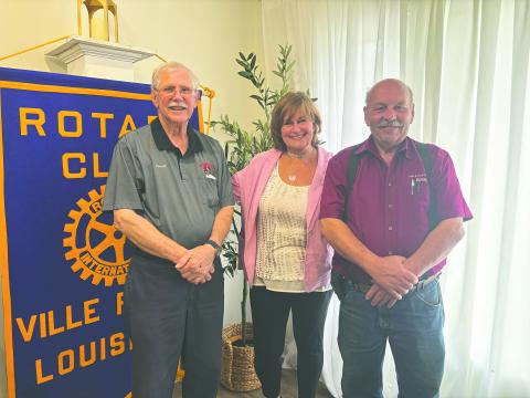 LANDRY SHARES FATHER’S STORY - Author Madelaine Landry addressed the June 10, meeting of the Ville Platte Rotary Club about her new book “Caro Giovanni” (Dear John). She is shown with Rotarian Kermit Miller (left) and Rotary President Bob Manuel (right). (Gazette photo by Heather Bogard)