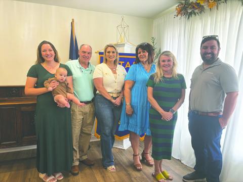 ECONOMIC DEVELOPMENT BOARD VISITS ROTARY - From left are Evangeline Parish Economic Development Board leaders Raquel Manuel (holding her son, Connor), Eric Fontenot, Krista Vidrine, Liz Chatelain, Opal Andrus and Rotary President Beau Wilson.  (Gazette photo by Heather Bogard)