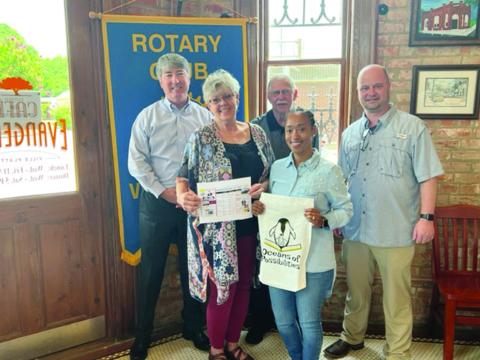 Pictured from left are: back row- Rotary President Jimmy LeBlanc, Rotarian Kermit Miller, and Evangeline Parish Library Director Dr. William Holmes; front row- Library Outreach Director Suzy Lemoine, and Outreach employee Keisha Ford. (Gazette photo by Tony Marks)