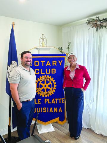 Rotary Club of Ville Platte speaker on Tuesday, July 1, and guest of Steve Phillips a Rotorian, was Sabrina Salling, government services representative of Cleco. Salling is pictured on the right with Rotary president Beau Wilson. (Gazette photo by Tony Marks)