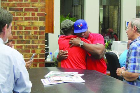 Ville Platte Mayor-Elect Ryan Leday Williams (center right) embraces a supporter as the election results are announced inside the Evangeline Parish Clerk of Court’s Office on Tuesday, November 8. (Gazette photo by Tony Marks)