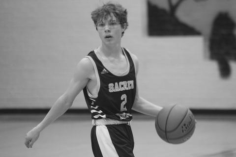 Hayden Deshotel (2) moves the basketball down the court against Mamou in a game played during the parish tournament earlier this season. (Gazette photo by Rhett Manuel)