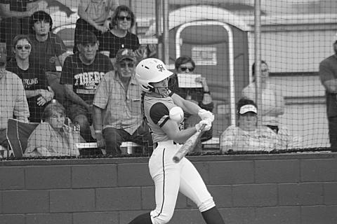 Lady Trojan Ava Johnson connects with a pitch in a game against Sam Houston at home. (Gazette photo by Rhett Manuel)