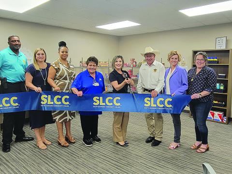 Pictured are Ville Platte Chief of Police Perry Thomas, Brittany Ducote (SLCC), Carleen Jones (SLCC), Mable Foreman (LHC Group), Lana Fontenot (SLCC), Evangeline Parish Sheriff Charles Guillory, State Representative Rhonda Butler (District 38), and Maggi Bienvenu (One Acadiana). (Photo courtesy of SLCC)