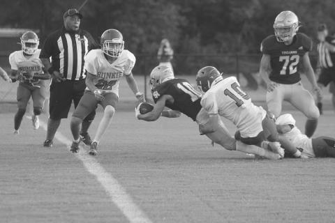 Trojan workhorse Blake Hebert (10) dives across the goaline for a Sacred Heart touchdown in a scrimmage against Bunkie held Friday, August 19. The team now takes on Pine Prairie in the Evangeline Parish Jamboree tomorrow night. (Gazette photo by Tony Marks)