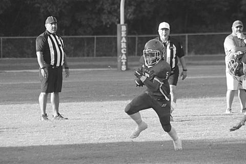 Basile’s Bryan Hardy (5) finds a running lane in the scrimmage Thursday night. (Gazette photo by Rhett Manuel)