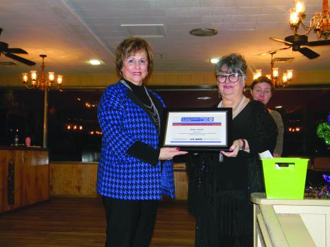 Sonia Ardoin, board member on the St. Landry-Evangeline United Way, (left)was honored as Board Member of the Year during the annual appreciation banquet held Monday, January 24, at Toby’s Lounge and Reception Hall in Opelousas. She is shown with Executive Director Ginger LeCompte. Standing behind LeCompte is Dori Comeaux, Community Outreach Director. (Gazette photo by Heather Bogard)