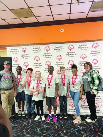 From left are Coach Chad Lafleur, Christopher Louis, Christopher Bergeron, Aubrey LaHaye, Noah Fontenot, Colby Lasage, Montashia Attle, and Coach Valerie Fontenot. Not pictured is Dane Thibodeaux. (Photo courtesy of Tommy Jones)
