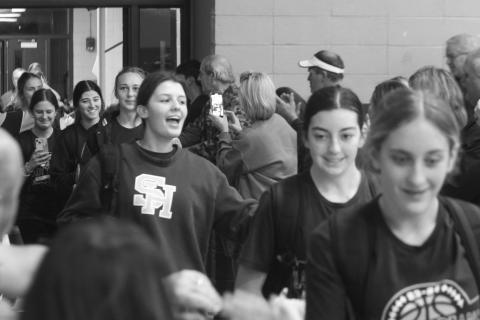 The Sacred Heart Lady Trojans are treated to a hero’s welcome as they return to the Halls of Troy after winning the District 6-1A championship on Tuesday night. (Gazette photo by Rhett Manuel)
