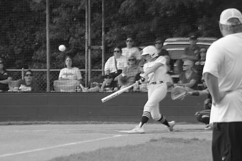Sacred Heart flex player Jenna Veillon (6) connects with a pitch in the Lady Trojans’ 11-1 win over St. John in the second round of the Division IV Select softball playoffs. (Gazette photo by Rhett Manuel)