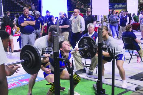 Pictured on the left is Sacred Heart’s Lily Deshotel as she squats on Thursday. (Gazette photo by Tony Marks)