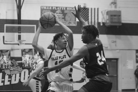 Jaden Jacobs looks to pass the basketball in Ville Platte High’s playoff loss to Sterlington. (Gazette photo by Rhett Manuel)