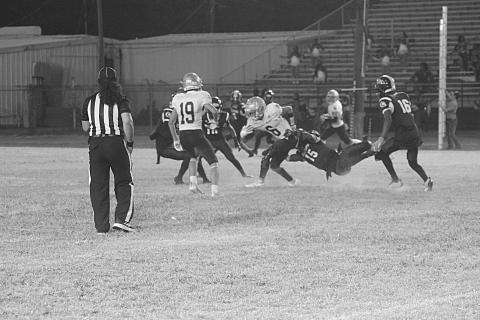 Sacred Heart’s Landon LeBlanc (6) holds onto the ball while trying to shake off a tackle from Ville Platte’s Javarion Thomas (15). (Gazette photo by Rhett Manuel)