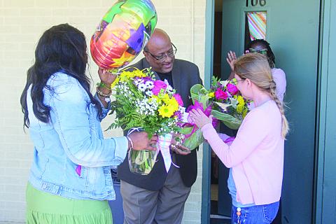 Fran Lemelle, principal of James Stephens Montessori, (left) along with Superintendent Darwan Lazard (center) present gifts to Melanie Soileau (right). (Gazette photo by Tony Marks)