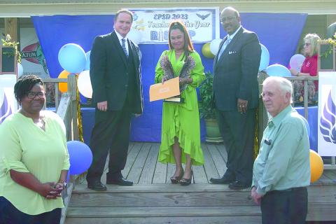 From left are Asst. Supt. Mike Lombas, High School Teacher of the Year Emee Aswell from Ville Platte High and Supt. Darwan Lazard. Aswell is a state semifinalist for teacher of the year. (Gazette photo by Tony Marks)