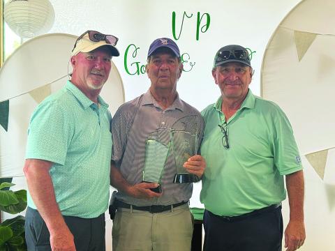 Ted Smith is pictured in the center with his trophies after winning the Ville Platte Golf and Country Club Championship. He is pictured with board member Brian LaFleur on the left and President T-Joe Fontenot on the right. (Photo courtesy of Ted Smith)