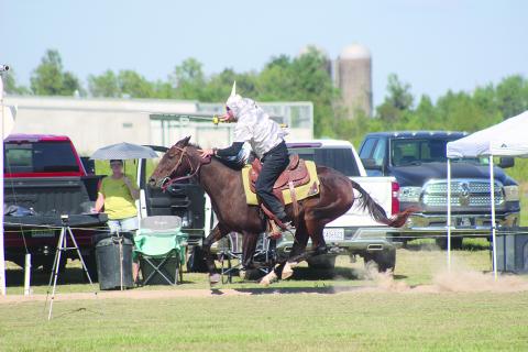 Brandon Snoke  is pictured as he rides Charlie during the first of three rounds of the Louisiana Tournoi on Sunday, October 12, at the Industrial Park. After all rounds, Snoke emerged as the champion for the first time. (Gazette photo by Tony Marks)