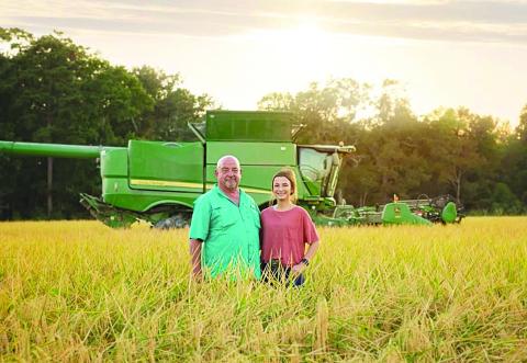 Troy Fruge with his daughter, Kynlee, on the Fruge Farm in Te-Mamou.