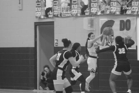 Bre Ardoin (24) keeps the basketball from going out of bounds for Sacred Heart in the finals of the girls’ Turkey Tournament against Jena. The Lady Trojans were the runner-up after a 64-37 loss to the Lady Giants. (Gazette photo by Tony Marks)