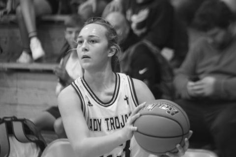 Jodie Landry (23) sets her feet as she readies to attempt a basket in Sacred Heart’s game against Basile. (Gazette photo by Rhett Manuel)