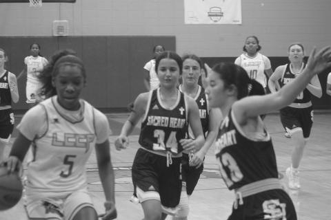 Olivia Tate (13) looks to make a defensive play in Sacred Heart’s 63-45 loss against Lake Charles College Prep. (Gazette photo by Tony Marks)