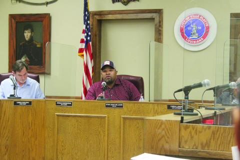 Ryan Leday Williams (right) conducts his first regular meeting after being elected  mayor of Ville Platte on Tuesday, January 10. Pictured on the left is new city clerk, treasurer, and tax collector Donald Bergeron. (Gazette photo by Tony Marks)