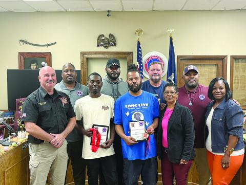 Pictured from left are (back row) Councilman Shawn Roy, Councilman Bryant Riggs, Councilman Tracey Jagneaux, and Mayor Ryan LeDay Williams; (front row) Fire Chief Chris Soileau, Jujaun Ben, Van Drecus Wilson, Councilwoman Anna Frank, and Councilwoman Christina Sam. (Gazette photo by Tony Marks)