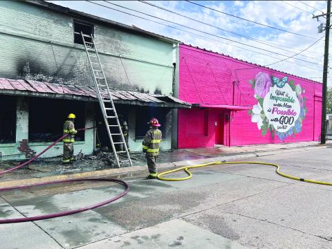 Members of the Ville Platte Fire Department work to finish as they extinguish a commercial structure fire on Friday, March 6. (Gazette photo by Nancy Duplechain)