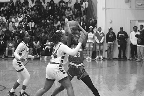 The Ville Platte Lady Bulldogs earned a 50-14 win over Port Barre in the first round of the playoffs at  home Thursday night. They will now play Mansfield at home in the second round. Pictured above is Raeosha Thomas (24) as she tries to get the ball away from Mamou’s Jalaysa Arvie (23) in a game earlier this season. (Gazette photo by Tony Marks)