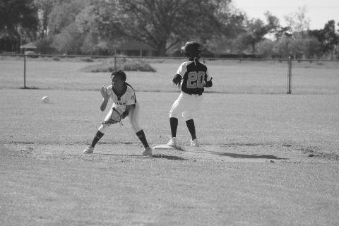 Pine Prairie’s Sydney Fontenot (20) advances to second base ahead of a throw to Ville Platte’s Janiah Leday. (Gazette photo by Tony Marks)