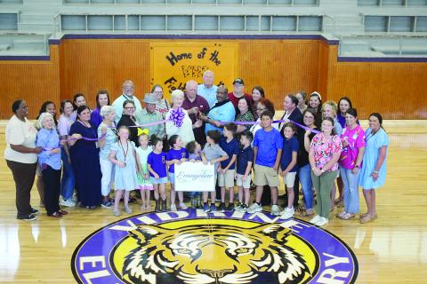 Among those pictured are Evangeline Chamber of Commerce board members Linda Fontenot and Dr. Gwen Fontenot, Elementary Supervisor Cherie Fontenot, Evangeline Parish School Board members Karen Vidrine and Bobby Hamlin, Superintendent Darwan Lazard, Assistant Superintendent Mike Lombas, Middle School Supervisor Sherral Tezeno, and Maintenance Supervisor Rico Guillory. (Gazette photo by Tony Marks)