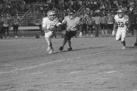 Ellis Fusilier (2) looks to find positive yards for his Sacred Heart Trojans in a loss to Westminster Christian Academy. (Gazette photo by Tony Marks)